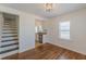 Dining room with hardwood floors, natural light, and open access to the kitchen at 1560 Temple Ave, College Park, GA 30337