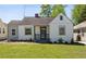 Charming bungalow with a well-manicured lawn and inviting front porch at 1560 Temple Ave, College Park, GA 30337