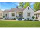Charming single-story home with well-maintained lawn, classic architecture, and inviting curb appeal at 1560 Temple Ave, College Park, GA 30337