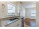 Bright kitchen with stainless steel appliances, granite countertops, and a window over the sink at 1560 Temple Ave, College Park, GA 30337