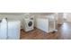 Attic with wood floors, laundry machines and stairs at 1560 Temple Ave, College Park, GA 30337