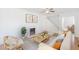 Bright living room with fireplace, ceiling fan, and cozy seating arrangement at 1560 Temple Ave, College Park, GA 30337