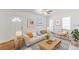 Bright living room featuring neutral decor, modern furnishings, and ample natural light at 1560 Temple Ave, College Park, GA 30337