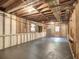 Large unfinished basement with concrete floor and exposed beams offers plenty of potential at 351 Ridgewater Dr, Marietta, GA 30068