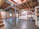 Unfinished basement offers open space for customization, with exposed ceiling and natural light at 351 Ridgewater Dr, Marietta, GA 30068