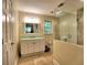 Elegant bathroom featuring a stylish vanity, framed mirror, and modern shower with glass door at 351 Ridgewater Dr, Marietta, GA 30068