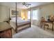 Cozy bedroom featuring a four-poster bed, ceiling fan and ample natural light at 351 Ridgewater Dr, Marietta, GA 30068