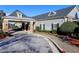 A convenient circular driveway leads to the covered entrance of the light gray clubhouse at 351 Ridgewater Dr, Marietta, GA 30068
