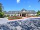 Frontal view of the clubhouse with a covered entrance and a circular driveway at 351 Ridgewater Dr, Marietta, GA 30068