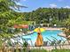 A refreshing community pool surrounded by mature trees, perfect for relaxation at 351 Ridgewater Dr, Marietta, GA 30068