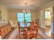 Bright dining room with a wooden table, chandelier, and a view of the kitchen, perfect for entertaining at 351 Ridgewater Dr, Marietta, GA 30068