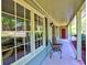 Inviting outdoor seating on the covered front porch, featuring charming decor and ample natural light at 351 Ridgewater Dr, Marietta, GA 30068