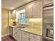 Kitchen with white cabinets, granite countertops, stainless steel appliances, and a large window at 351 Ridgewater Dr, Marietta, GA 30068