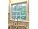 Bright kitchen window offering a lovely view, complemented by a stainless steel faucet and granite countertops at 351 Ridgewater Dr, Marietta, GA 30068
