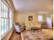 Comfortable living room featuring a sofa, armchairs, and a large patterned rug at 351 Ridgewater Dr, Marietta, GA 30068