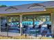 Outdoor tables and chairs near the community pool, ideal for socializing and dining at 351 Ridgewater Dr, Marietta, GA 30068