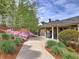 Picturesque walkway leading to the pool house with beautiful landscaping at 351 Ridgewater Dr, Marietta, GA 30068