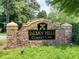 Stone entrance sign reading 'Indian Hills Country Club', set amidst landscaped greenery at 351 Ridgewater Dr, Marietta, GA 30068
