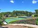 Scenic view of meticulously maintained tennis courts surrounded by lush greenery, ideal for sports enthusiasts at 351 Ridgewater Dr, Marietta, GA 30068