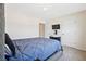 Comfortable bedroom with a plush blue comforter and mounted TV at 1196 Erica Se Way, Atlanta, GA 30354