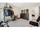 Bedroom featuring a large dresser, clothing racks, and seating area at 1196 Erica Se Way, Atlanta, GA 30354