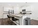 Kitchen with white cabinets, granite countertops, stainless steel appliances, and luxury vinyl plank flooring at 1196 Erica Se Way, Atlanta, GA 30354