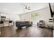 Spacious living room flows into the kitchen, featuring wood floors and ample natural light at 1196 Erica Se Way, Atlanta, GA 30354