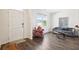Bright living room features luxury vinyl plank flooring, modern furniture, and natural light at 1196 Erica Se Way, Atlanta, GA 30354