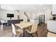 Open concept living space with a dining area, kitchen island, and luxury vinyl plank flooring at 1196 Erica Se Way, Atlanta, GA 30354