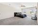 Bright main bedroom with large windows, a ceiling fan, carpeting and a comfortable king bed at 1196 Erica Se Way, Atlanta, GA 30354