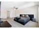 Large main bedroom featuring a king bed, accent table, and neutral decor at 1196 Erica Se Way, Atlanta, GA 30354
