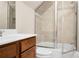 Bathroom featuring glass enclosed shower, tile surround, with tile flooring, and a vanity with a white sink at 135 Haleys Cir, Woodstock, GA 30188