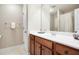 Bathroom featuring a wooden vanity with a white countertop, a white sink, and chrome fixtures at 135 Haleys Cir, Woodstock, GA 30188