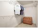 Walk-in closet with built-in shelving and drawers, providing ample storage space for an organized wardrobe at 135 Haleys Cir, Woodstock, GA 30188
