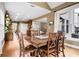 Dining area featuring hardwood floors, and seamless transition to an open-plan kitchen at 135 Haleys Cir, Woodstock, GA 30188