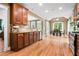 Open kitchen layout with stainless steel appliances, granite counters, and eat-in area at 135 Haleys Cir, Woodstock, GA 30188
