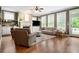 Inviting living room boasts hardwood floors, a cozy fireplace, and ample natural light at 135 Haleys Cir, Woodstock, GA 30188