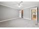 Large bedroom with ceiling fan and access to closet and bathroom at 2007 Wingate Way, Atlanta, GA 30350
