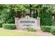 Stonepark private residence sign with decorative stone pillars, manicured greenery and trees as a backdrop at 2007 Wingate Way, Atlanta, GA 30350