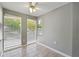 Cozy sunroom bathed in natural light, features tile floors and views of the surrounding greenery at 2007 Wingate Way, Atlanta, GA 30350