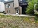 View of the house's exterior with a patio area at 3045 Wyntree Dr, Peachtree Corners, GA 30071