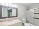 This bathroom features a granite counter, a sliding glass door to shower and tile accents at 3045 Wyntree Dr, Peachtree Corners, GA 30071