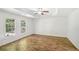 Spacious bedroom featuring hardwood floors and two windows allowing for ample natural light at 3045 Wyntree Dr, Peachtree Corners, GA 30071