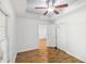 This bedroom features wood floors, ceiling fan, tray ceiling, and double door closet at 3045 Wyntree Dr, Peachtree Corners, GA 30071