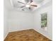 This bedroom features beautiful hardwood floors and a ceiling fan at 3045 Wyntree Dr, Peachtree Corners, GA 30071