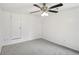 This bedroom features neutral carpet and a modern ceiling fan at 3045 Wyntree Dr, Peachtree Corners, GA 30071