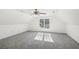 Spacious bedroom featuring ample natural light, neutral walls, and a ceiling fan at 3045 Wyntree Dr, Peachtree Corners, GA 30071