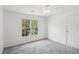 This bedroom features a ceiling fan and a window with natural light at 3045 Wyntree Dr, Peachtree Corners, GA 30071
