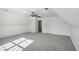 This bonus room features neutral carpet and a ceiling fan at 3045 Wyntree Dr, Peachtree Corners, GA 30071