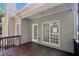 Back deck of home with wood floors, views of yard, and door leading to the home's interior at 3045 Wyntree Dr, Peachtree Corners, GA 30071